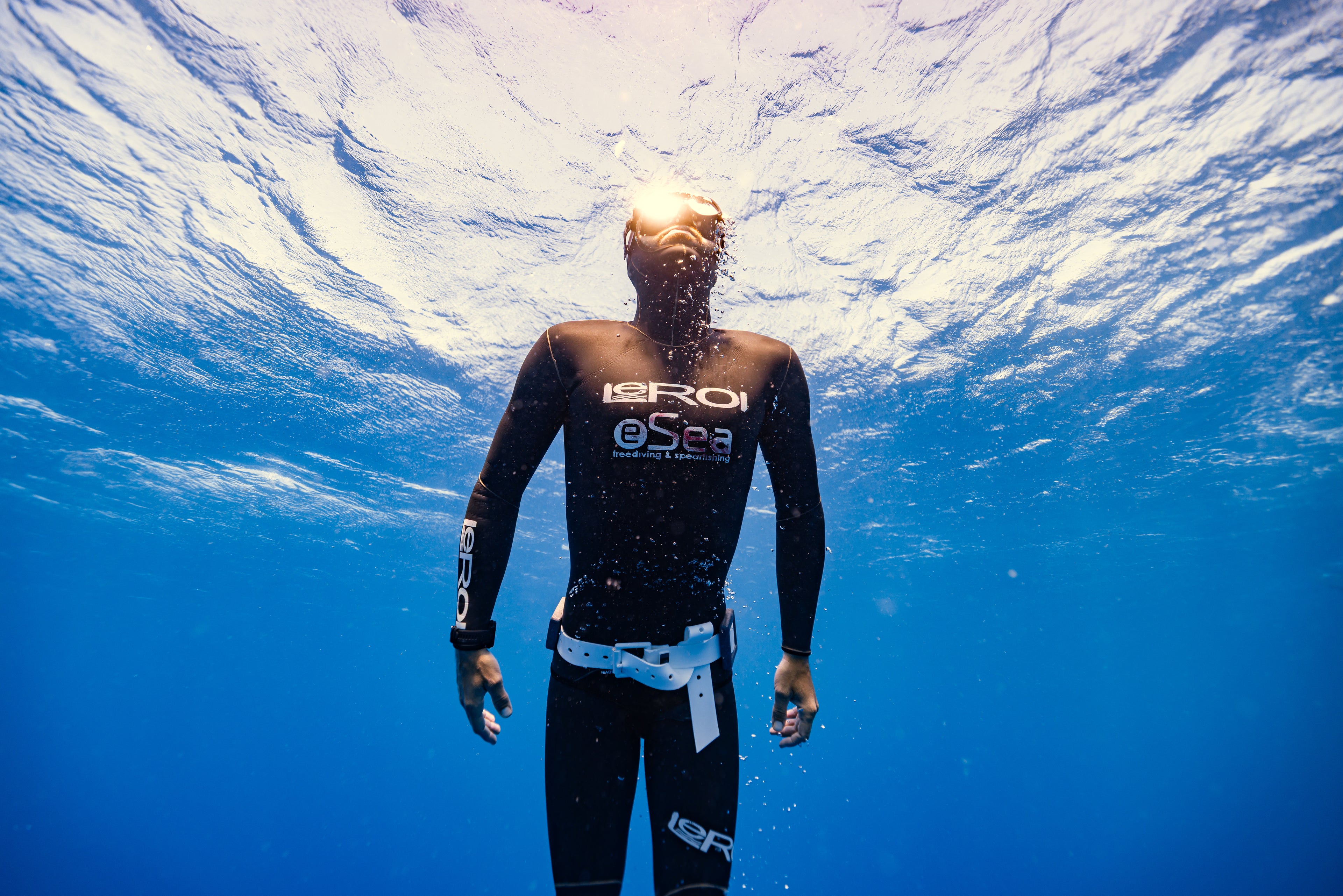 Giovanni Bianco coming to the surface after a freediving session, wearing a Leroi suit, demonstrating his expertise in breath-hold and technique